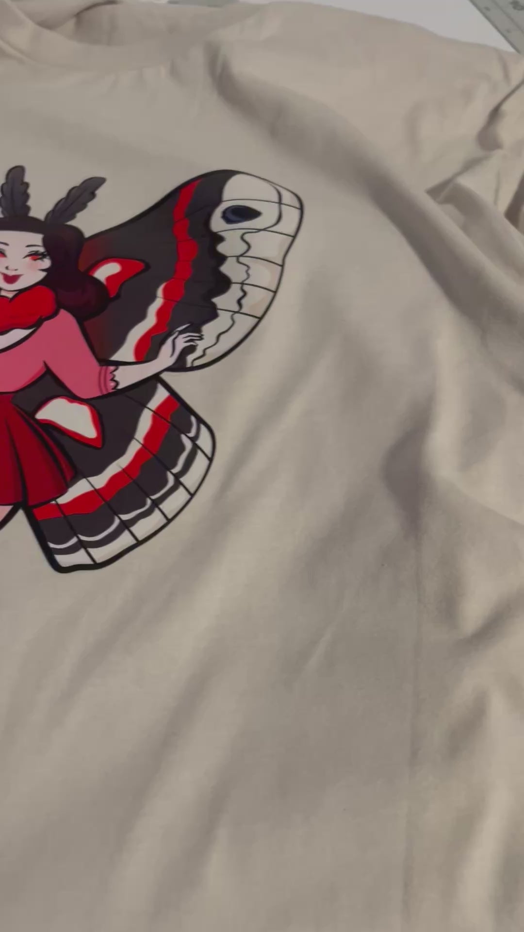 Mesmerized by the Mothwoman T-Shirt